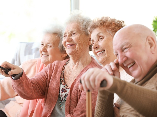 Group of aged care residents enjoying a movie