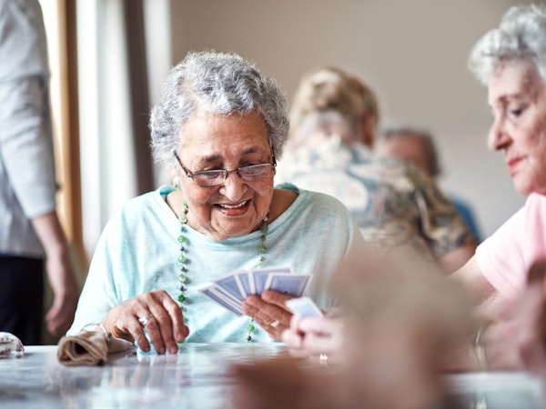 Woman participating in activities with other residents.