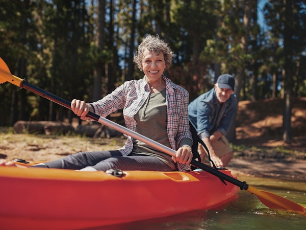 Older couple going for a kayak during their retirement