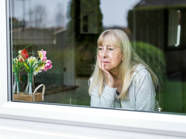 Woman looking out a window