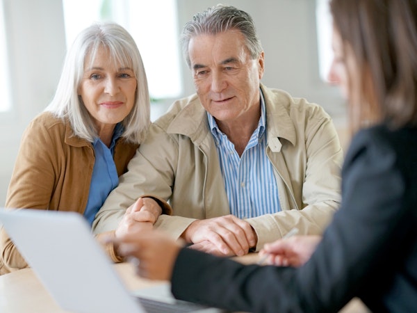 Older couple talking to a financial advisor