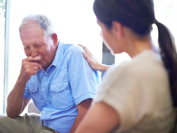 Older man receiving news for a doctor